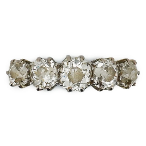 223 - A five-stone diamond ring, early 20th century, set with a sequence of five antique cushion-shaped di... 