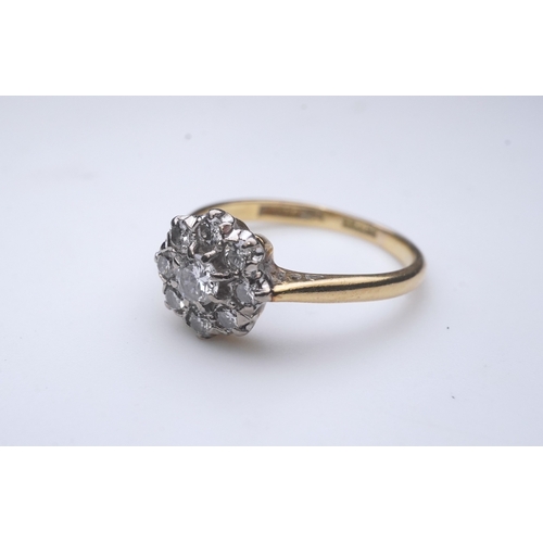 224 - Asprey & Co., a diamond ring, of cluster design, claw-set with brilliant-cut diamonds totalling appr... 