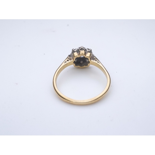 224 - Asprey & Co., a diamond ring, of cluster design, claw-set with brilliant-cut diamonds totalling appr... 