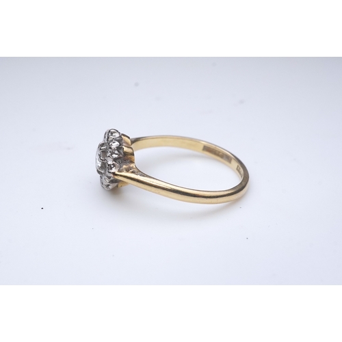 224 - Asprey & Co., a diamond ring, of cluster design, claw-set with brilliant-cut diamonds totalling appr... 