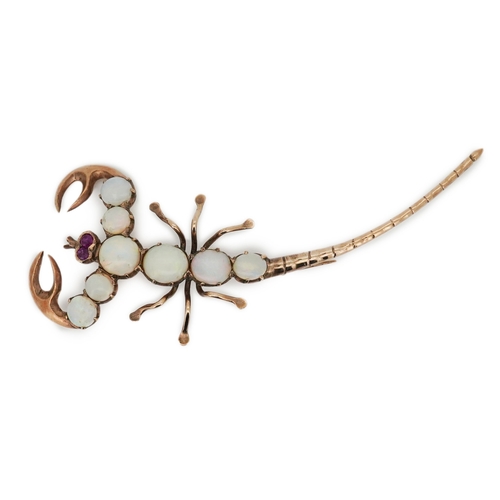 225 - An opal brooch, mid 20th century, designed as a scorpion, its body set with cabochon opals, its eyes... 