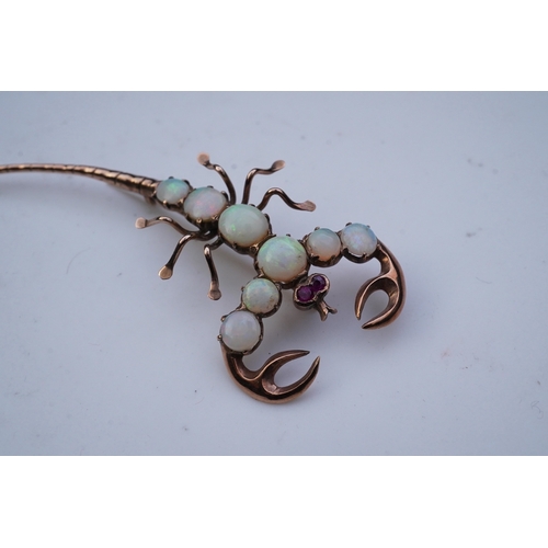 225 - An opal brooch, mid 20th century, designed as a scorpion, its body set with cabochon opals, its eyes... 