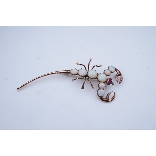 225 - An opal brooch, mid 20th century, designed as a scorpion, its body set with cabochon opals, its eyes... 