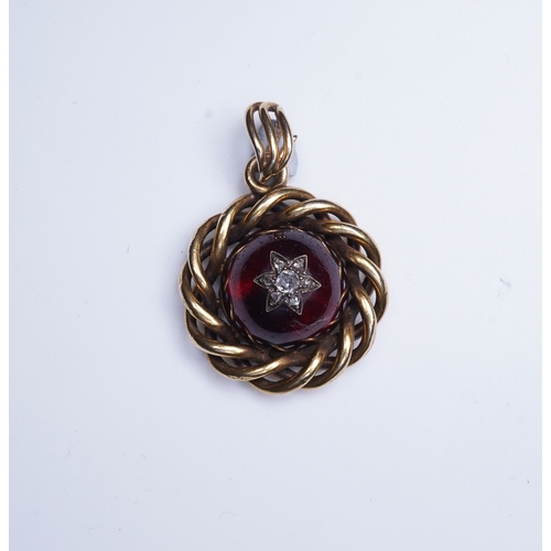 227 - A Victorian garnet and diamond pendant, mid 19th century set with a cabochon garnet inlaid with a st... 