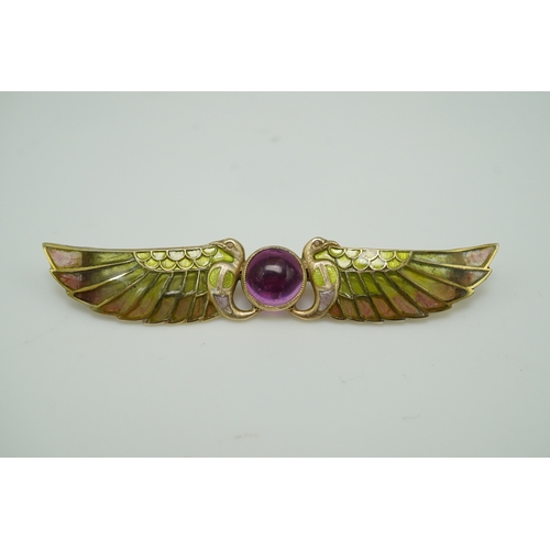 228 - An Egyptian Revival tourmaline and enamel brooch, circa 1900 centring on a cabochon pink tourmaline,... 