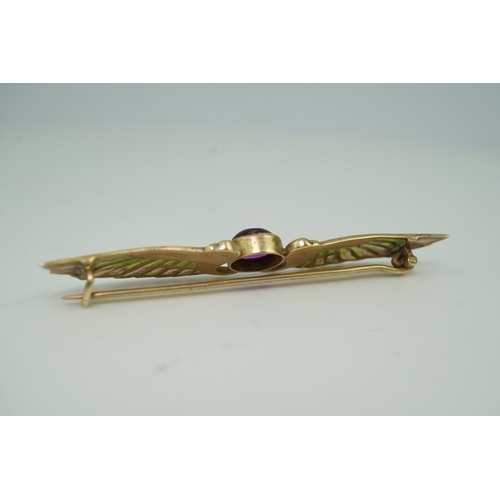 228 - An Egyptian Revival tourmaline and enamel brooch, circa 1900 centring on a cabochon pink tourmaline,... 