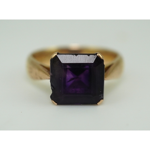 229 - A late Victorian amethyst ring, circa 1893 claw-set with a step-cut amethyst, inscribed '25 April 18... 