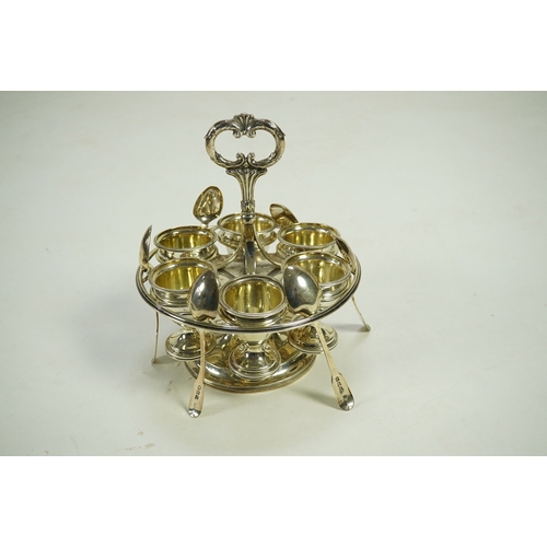 23 - A George III silver egg cruet stand, with six egg cups and six spoons (one not matching), by Solomon... 