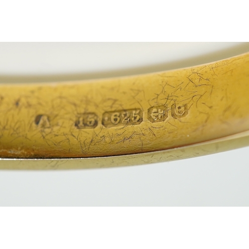 232 - An Edwardian 15ct gold and diamond bangle, circa 1904, the hinged bangle set to the front with a seq... 