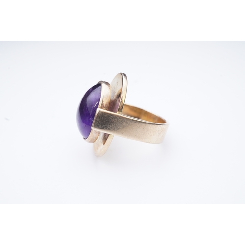 237 - Reeslev, an amethyst ring, Denmark, collet-set with a cabochon amethyst, within a polished oval bord... 