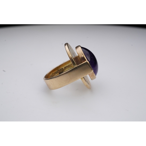 237 - Reeslev, an amethyst ring, Denmark, collet-set with a cabochon amethyst, within a polished oval bord... 