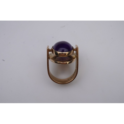 237 - Reeslev, an amethyst ring, Denmark, collet-set with a cabochon amethyst, within a polished oval bord... 