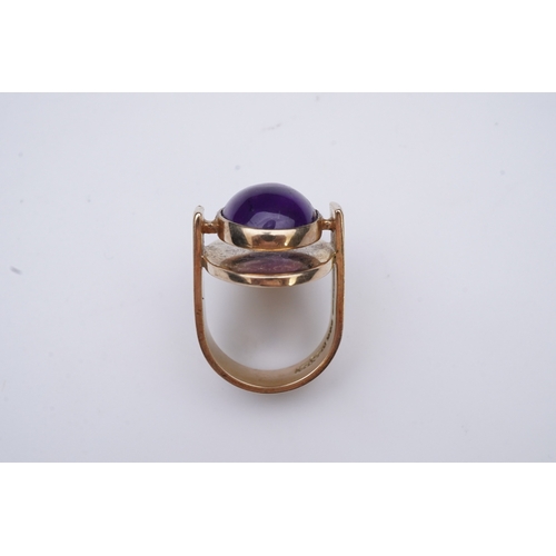 237 - Reeslev, an amethyst ring, Denmark, collet-set with a cabochon amethyst, within a polished oval bord... 