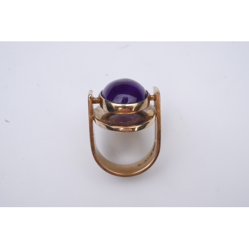 237 - Reeslev, an amethyst ring, Denmark, collet-set with a cabochon amethyst, within a polished oval bord... 