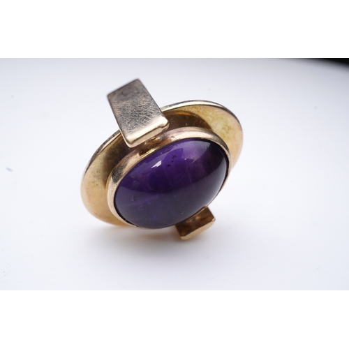 237 - Reeslev, an amethyst ring, Denmark, collet-set with a cabochon amethyst, within a polished oval bord... 