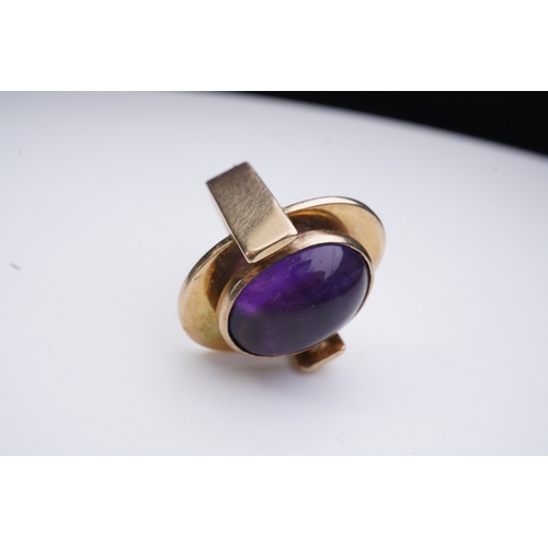 237 - Reeslev, an amethyst ring, Denmark, collet-set with a cabochon amethyst, within a polished oval bord... 