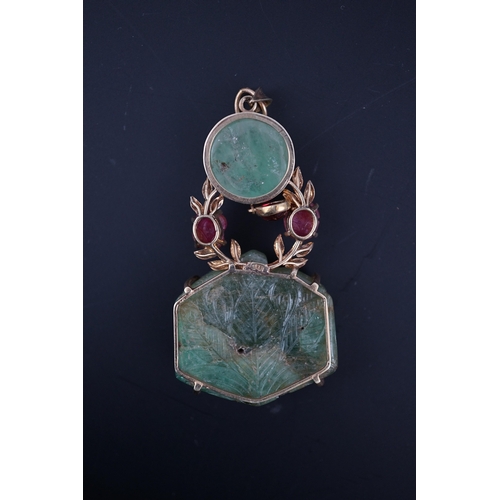 238 - An unusual Mughal-style emerald, ruby and synthetic ruby pendant, second half 20th century, composed... 