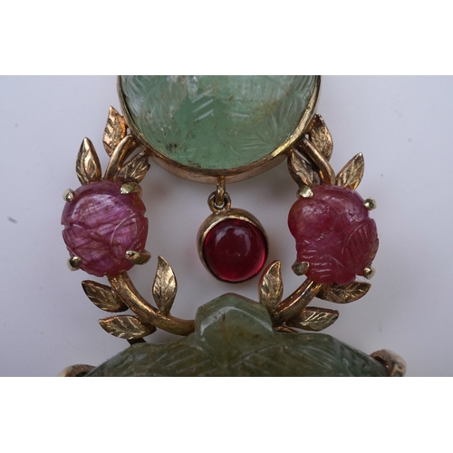 238 - An unusual Mughal-style emerald, ruby and synthetic ruby pendant, second half 20th century, composed... 