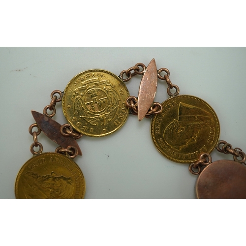 242 - A late 19th century gold coin bracelet, with torpedo links and set with five South African gold half... 