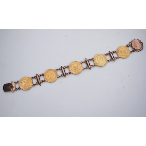 242 - A late 19th century gold coin bracelet, with torpedo links and set with five South African gold half... 