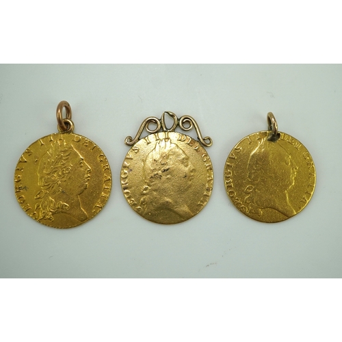 247 - Three George III gold spade guinea coin pendants, late 18th/early 19th century and later, the three ... 