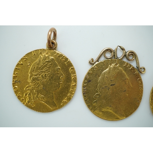 247 - Three George III gold spade guinea coin pendants, late 18th/early 19th century and later, the three ... 