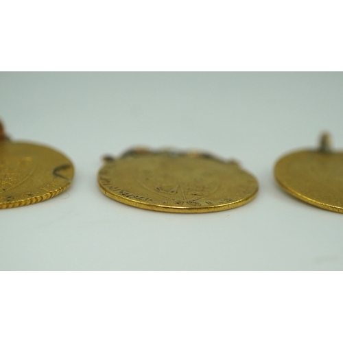 247 - Three George III gold spade guinea coin pendants, late 18th/early 19th century and later, the three ... 