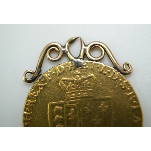 247 - Three George III gold spade guinea coin pendants, late 18th/early 19th century and later, the three ... 