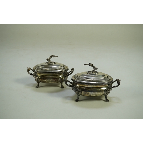 25 - A pair of George III silver two handled oval sauce tureens and covers, by Robert Garrard I, with fol... 