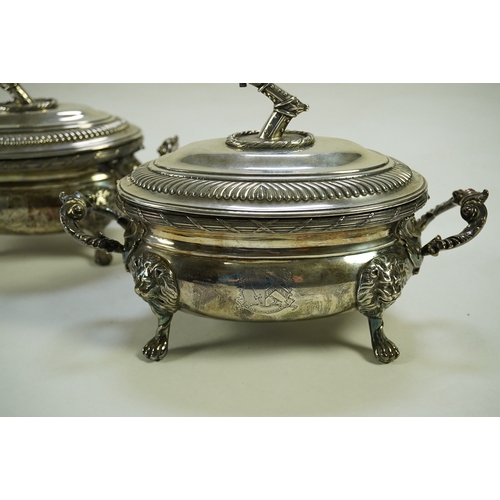 25 - A pair of George III silver two handled oval sauce tureens and covers, by Robert Garrard I, with fol... 