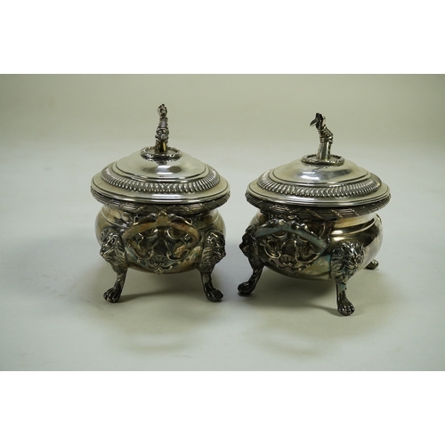 25 - A pair of George III silver two handled oval sauce tureens and covers, by Robert Garrard I, with fol... 