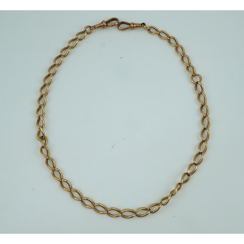 250 - An Edwardian gold Albert chain, early 20th century, of curb linking, each end with a hook clasp, len... 