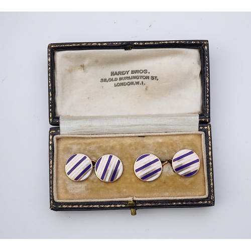 257 - A pair of gold and enamel cufflinks each end of circular outline, applied with alternating stripes o... 