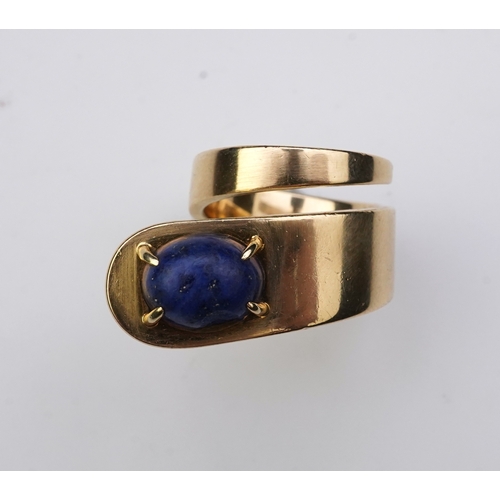 258 - Jean Dinh Van for Cartier, a lapis lazuli ring, circa 1970 designed as a tapered coil, claw-set with... 