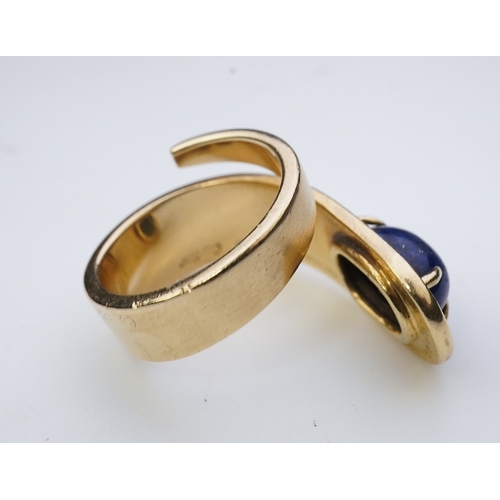 258 - Jean Dinh Van for Cartier, a lapis lazuli ring, circa 1970 designed as a tapered coil, claw-set with... 