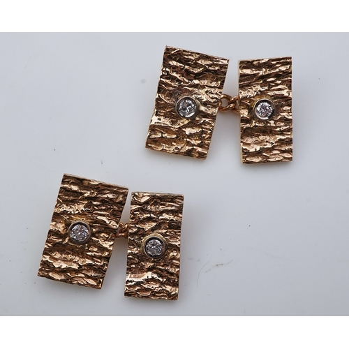 259 - A pair of 9ct gold and diamond cufflinks, 1970s each end of rectangular outline in textured 9ct gold... 