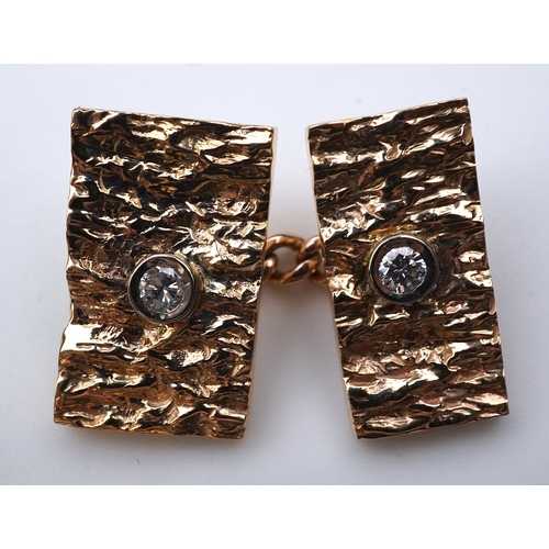 259 - A pair of 9ct gold and diamond cufflinks, 1970s each end of rectangular outline in textured 9ct gold... 