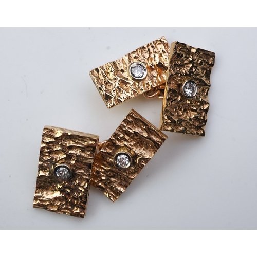 259 - A pair of 9ct gold and diamond cufflinks, 1970s each end of rectangular outline in textured 9ct gold... 