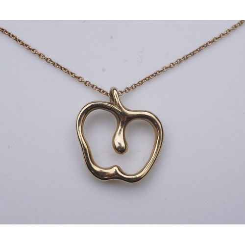 261 - Elsa Peretti for Tiffany & Co., a gold pendant, designed as a stylised apple on a fine link chain, p... 