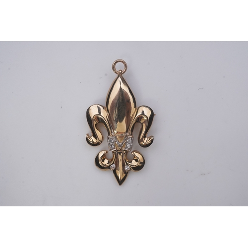 262 - A gold and diamond pendant/brooch, designed as a fleur-de-lis, the letter 'M' pavé-set with brillian... 