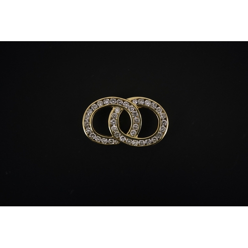 263 - A diamond pendant, designed as interlocking hoops set with brilliant-cut diamonds totalling approxim... 