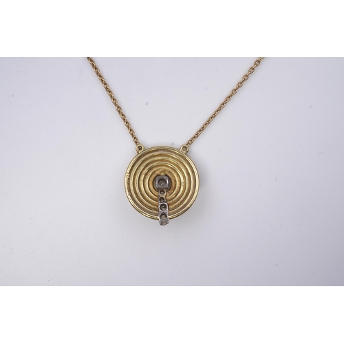 265 - An 18ct gold and diamond pendant, circa 1978, designed as a grooved disc set with a line of graduate... 