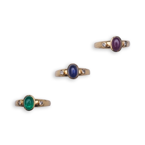 268 - A suite of three gold and gem-set rings, the three rings each set with a cabochon emerald, sapphire ... 