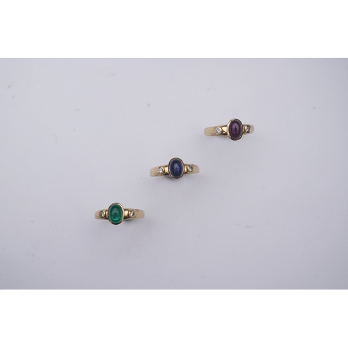 268 - A suite of three gold and gem-set rings, the three rings each set with a cabochon emerald, sapphire ... 