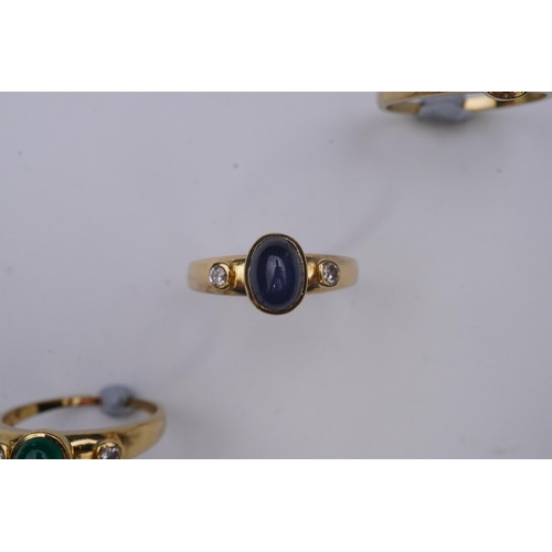 268 - A suite of three gold and gem-set rings, the three rings each set with a cabochon emerald, sapphire ... 