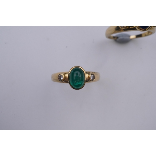 268 - A suite of three gold and gem-set rings, the three rings each set with a cabochon emerald, sapphire ... 