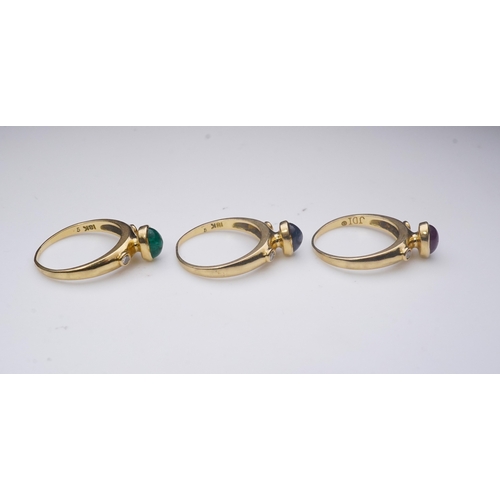 268 - A suite of three gold and gem-set rings, the three rings each set with a cabochon emerald, sapphire ... 