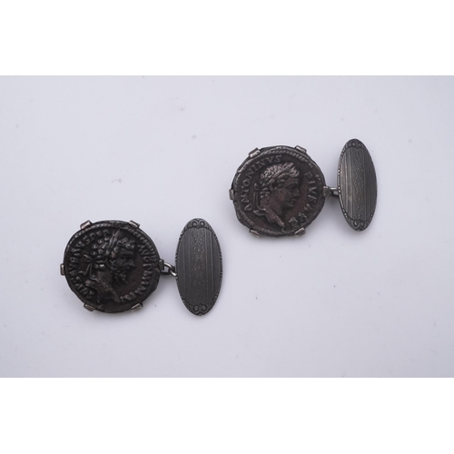 270 - A pair of coin cufflinks, each set with a coin, depicting the emperors Antoninus Pius (r.138-161) an... 