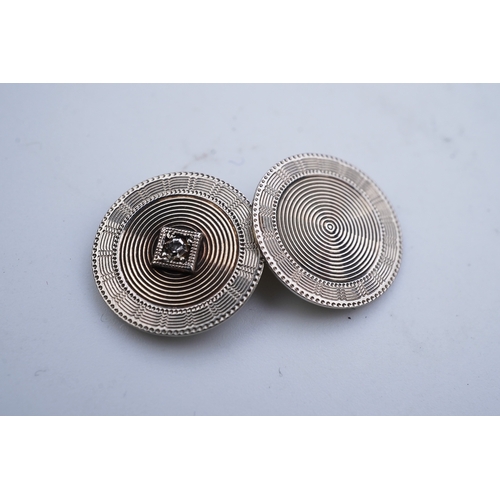 273 - Zeithing, a pair of Art Deco gold and diamond cufflinks, Newark, New Jersey, 1920s each of engine tu... 