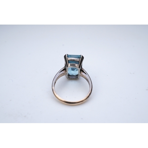 274 - An aquamarine ring, mid 20th century, claw-set with a mixed step-cut aquamarine measuring approximat... 